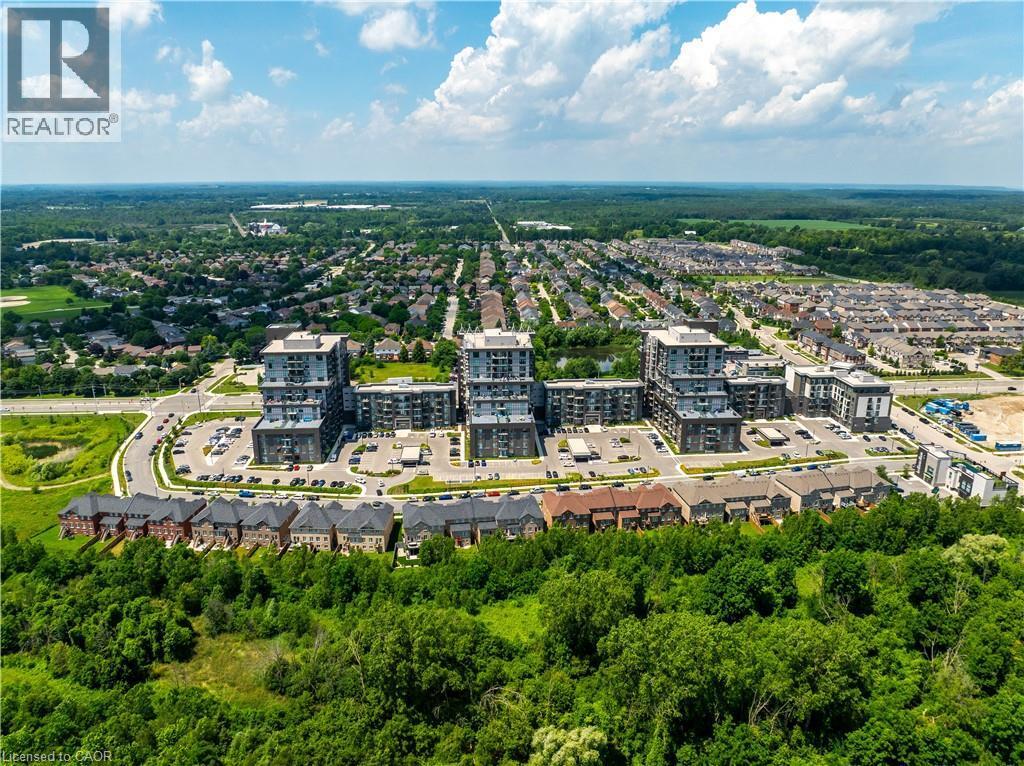 Aerial perspective showcasing residential buildings and expansive green spaces - 10 Mallard Trail Unit# 237, Waterdown, ON