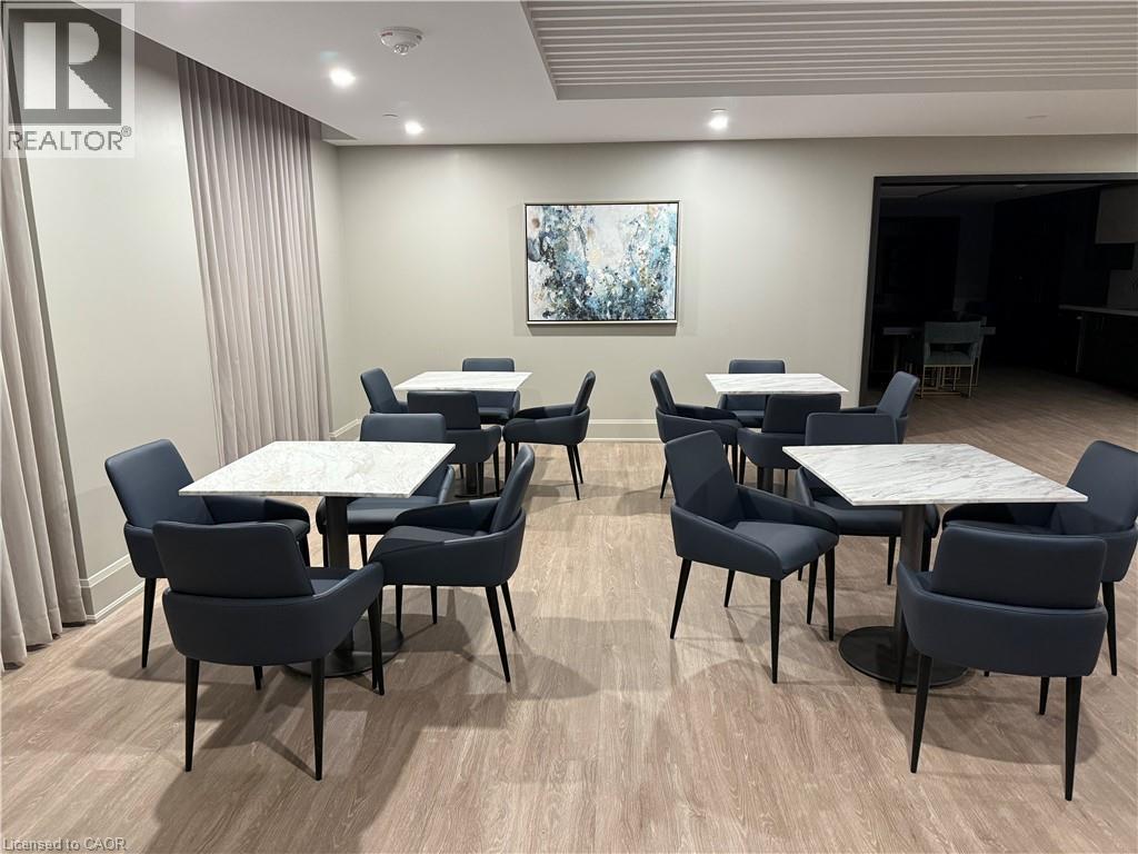 Recessed lighting, wood-finish flooring, and light-toned walls - 10 Mallard Trail Unit# 237, Waterdown, ON