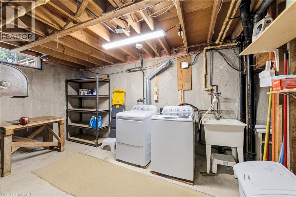 Newer washer and dryer, shelving, work bench, laundry tub - 450 Brigadoon Drive, Hamilton, ON