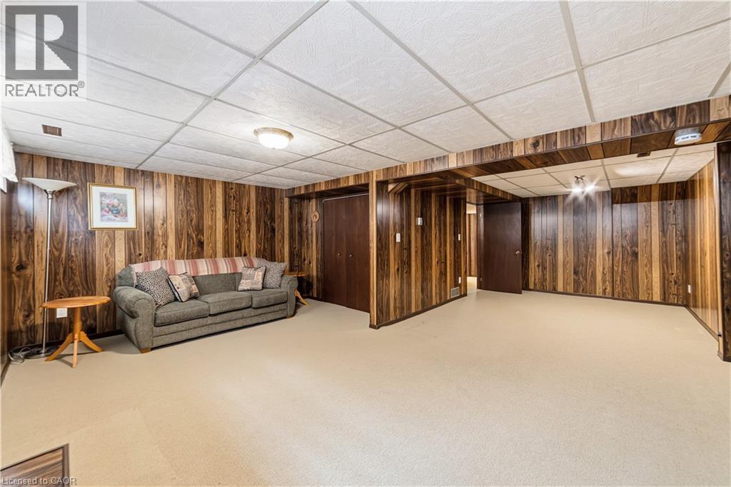 Recreation room, light carpeting, closet means and easier conversion for this space to be used as a 4th bedroom - 450 Brigadoon Drive, Hamilton, ON