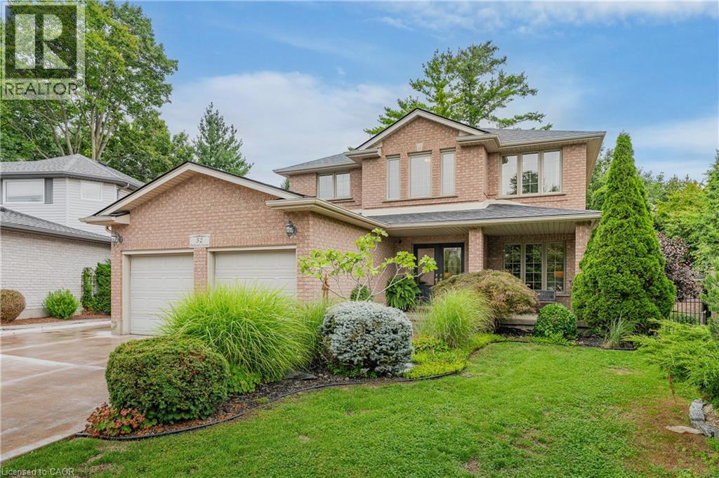 Brick exterior with a covered porch entry - 52 Archwood Crescent, Cambridge, ON