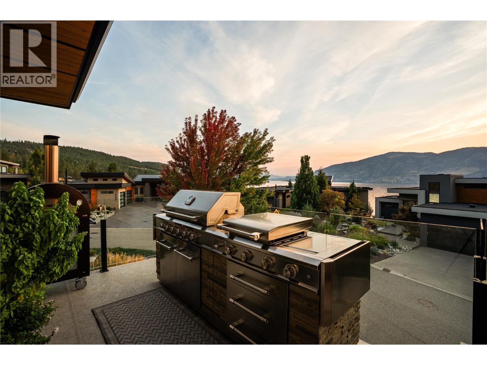 BBQ area at twilight - 1666 Lakestone Drive, Lake Country, BC