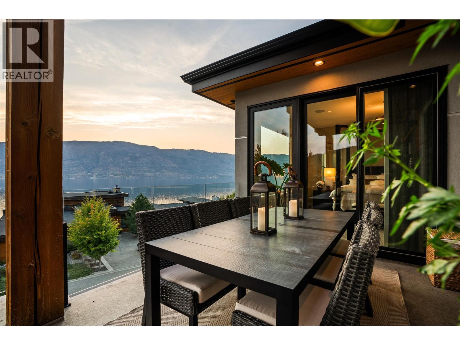 Outdoor dining at twilight - 1666 Lakestone Drive, Lake Country, BC