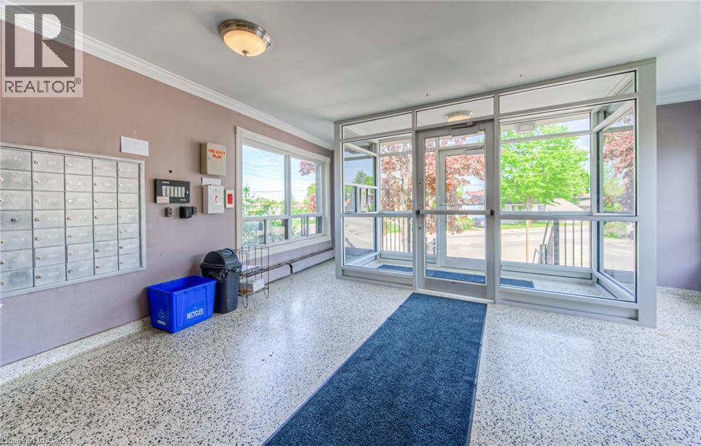 Lobby featuring ornamental molding - 283 Fairway Road N Unit# 501, Kitchener, ON