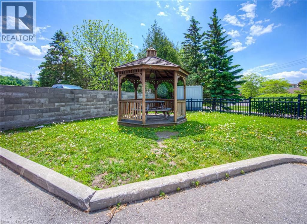 Fenced backyard with a gazebo - 283 Fairway Road N Unit# 501, Kitchener, ON