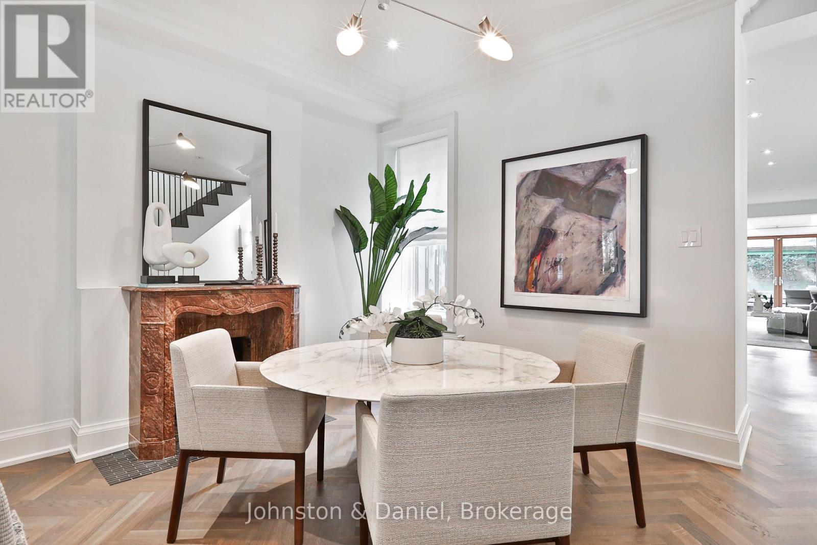 Elegant dining room with marble fireplace - 69 Sullivan Street, Toronto, ON