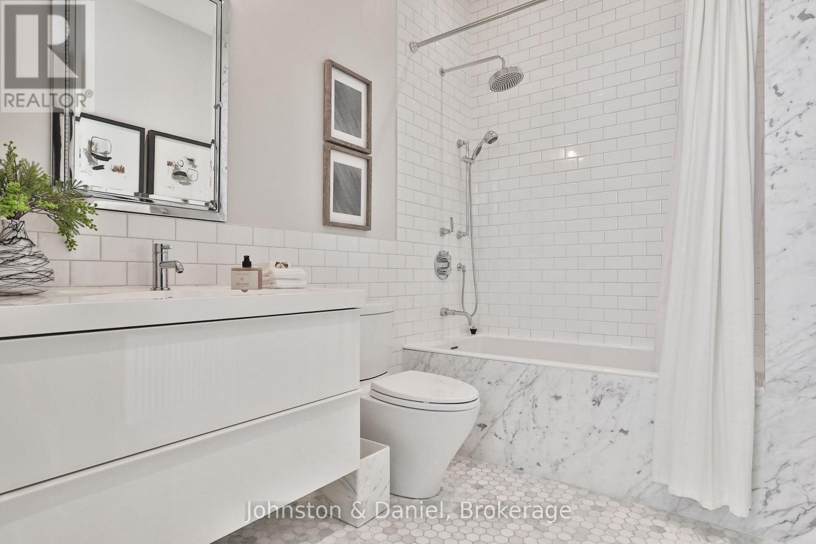Main 4-piece Calcutta marble bath, heated floors - 69 Sullivan Street, Toronto, ON