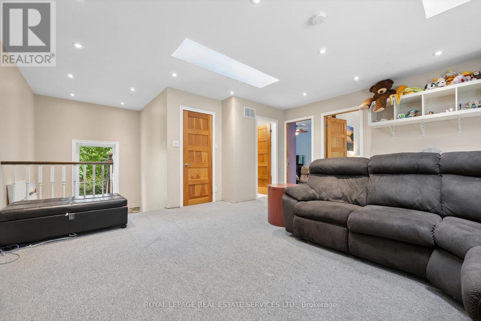The Bright Family Room Features Two Skylights - 46 Germorda Drive, Oakville, ON