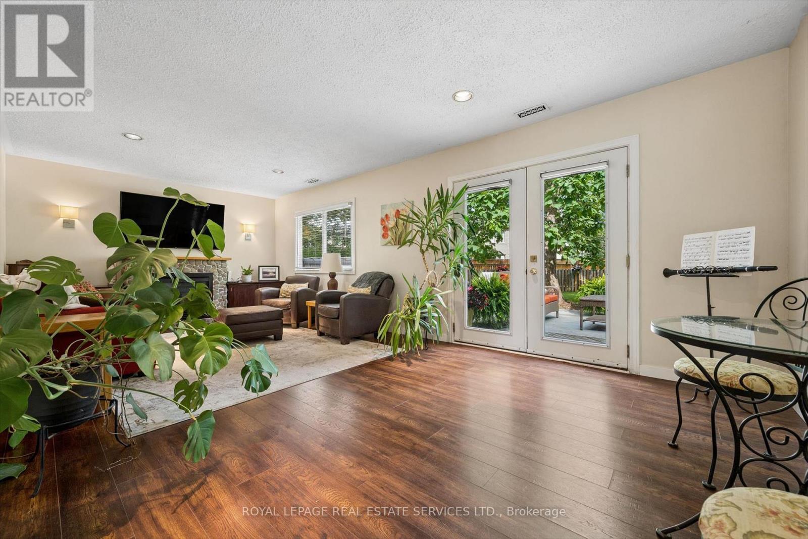 Living Room with a French Door Walkout to Deck - 46 Germorda Drive, Oakville, ON