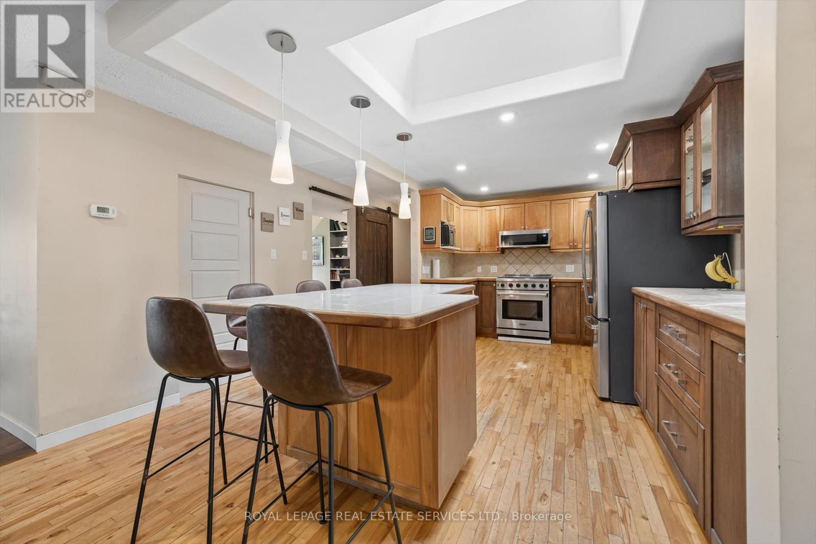 The Updated Kitchen is Highlighted by a Skylight - 46 Germorda Drive, Oakville, ON