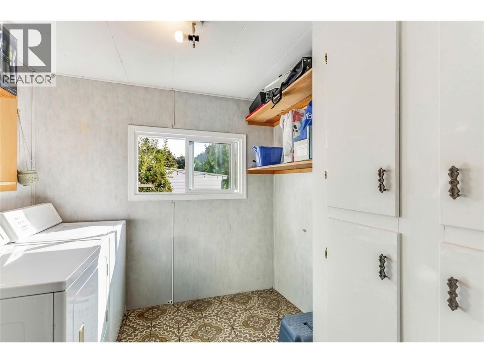 Laundry Room with additional storage - 1699 Ross Road Unit# 213, West Kelowna, BC