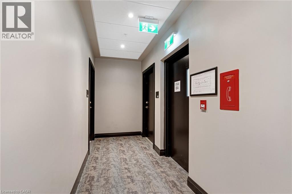 Hallway with recessed lighting and elevator - 50 Grand Avenue S Unit# 801, Cambridge, ON