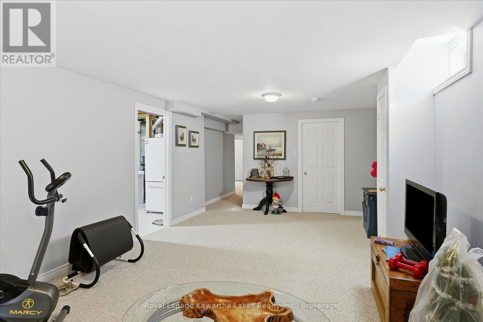 Recroom with newer carpet. - 10G - 25 Rivermill Boulevard, Kawartha Lakes (Lindsay), ON