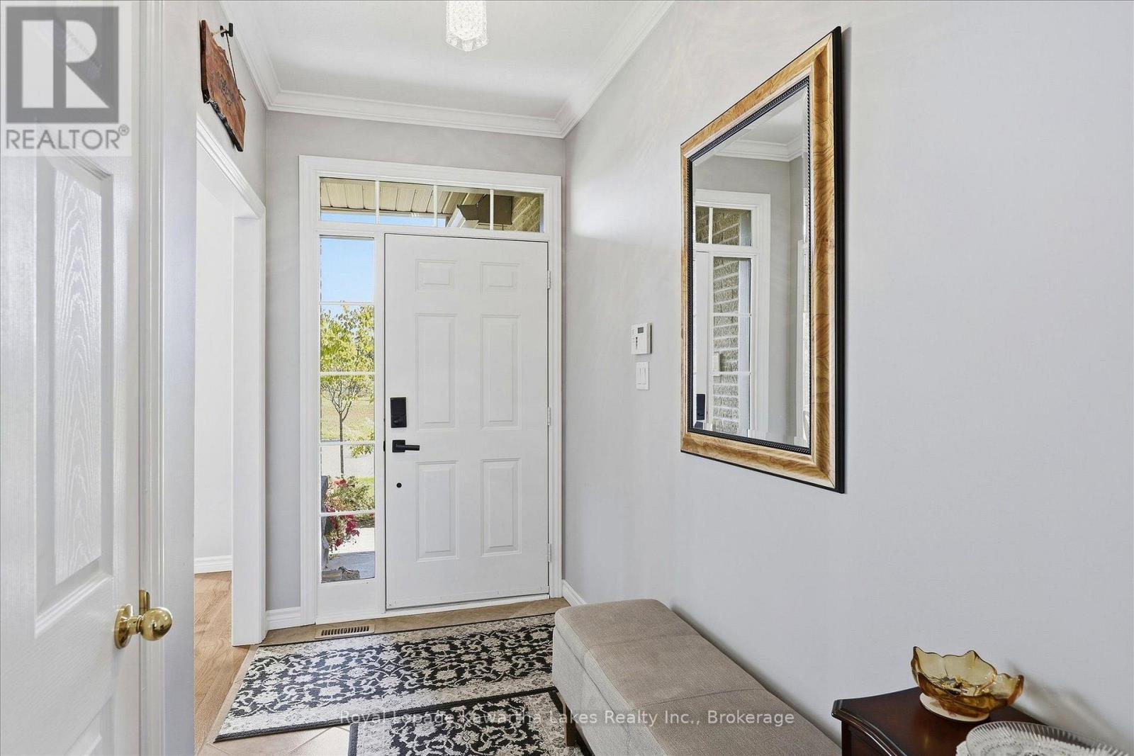 Front foyer with closet and ceramic floor. - 10G - 25 Rivermill Boulevard, Kawartha Lakes (Lindsay), ON
