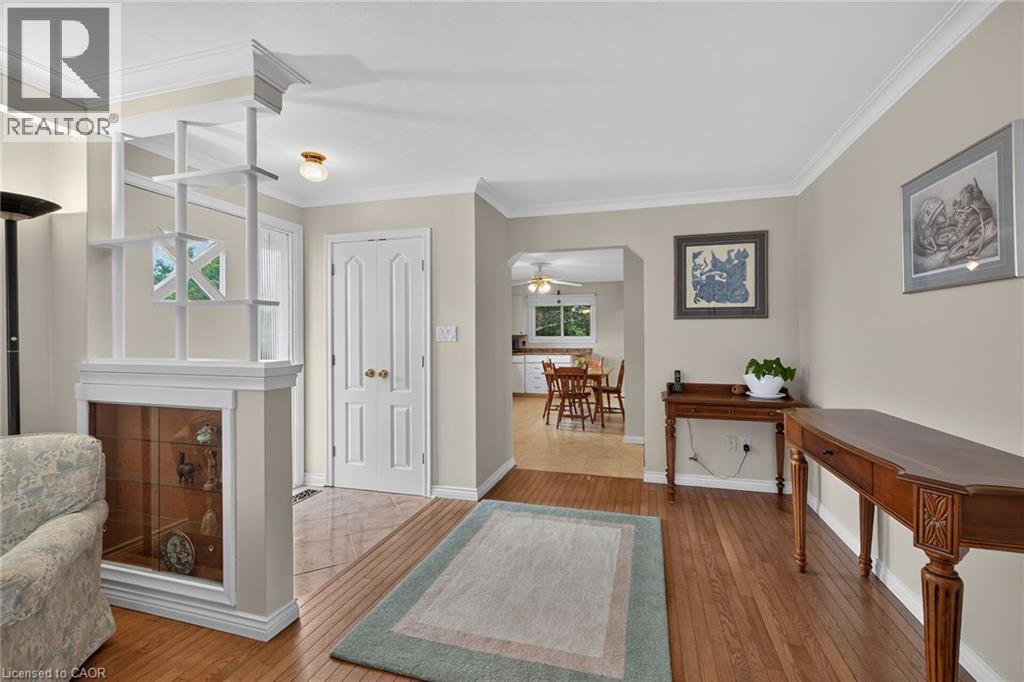 Hardwood flooring throughout, crown molding, and a built-in display cabinet - 799 Highway 6, Caledonia, ON