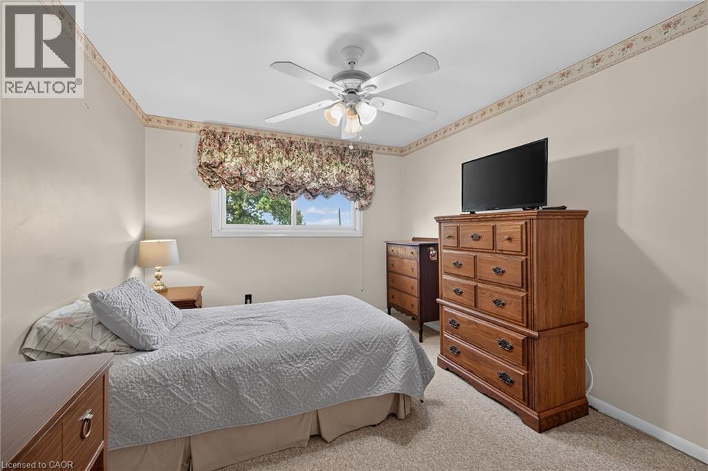 Wall-to-wall carpeting with light-toned walls and a window - 799 Highway 6, Caledonia, ON