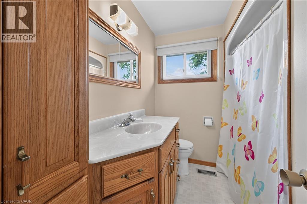 Wood-finish vanity with an integrated sink and laminate countertop - 799 Highway 6, Caledonia, ON