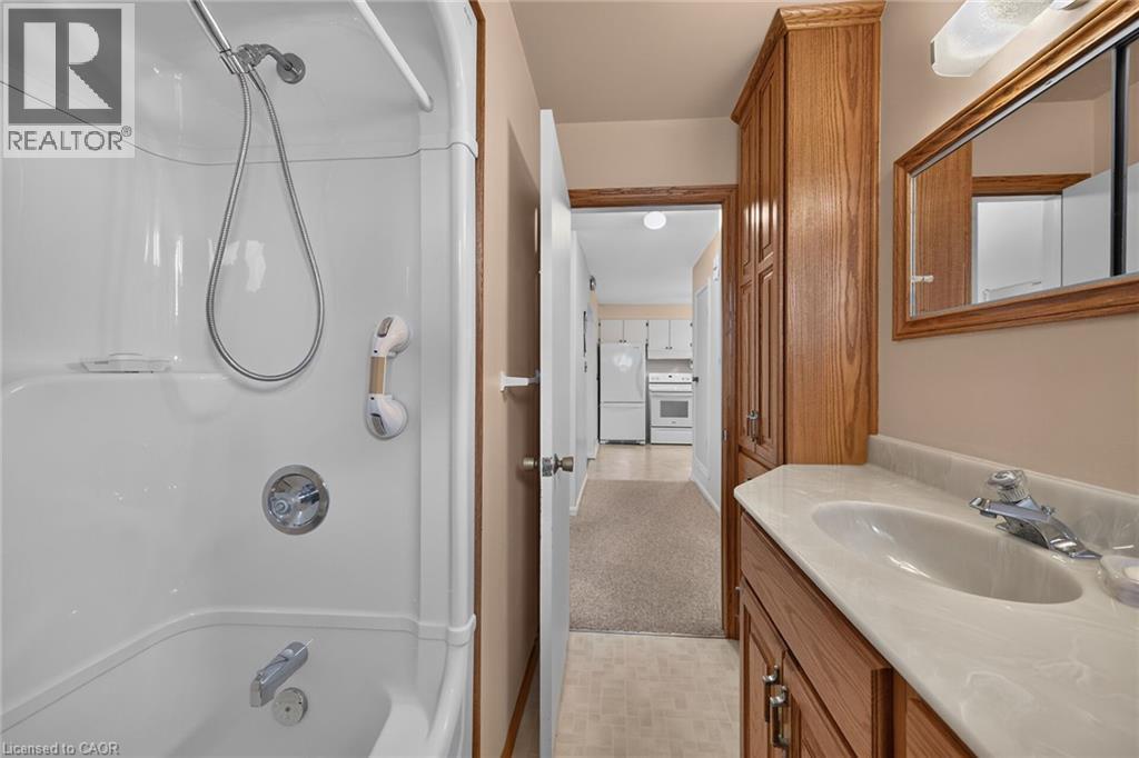 White fiberglass tub and shower combination with chrome fixtures - 799 Highway 6, Caledonia, ON