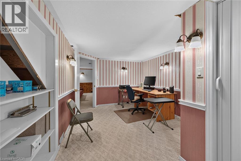 Carpeted flooring throughout, accented by wall-mounted lighting fixtures - 799 Highway 6, Caledonia, ON