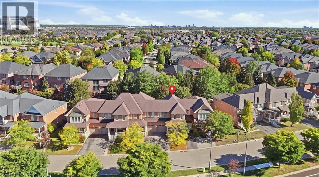 Residential neighborhood featuring established homes, mature trees, and paved roadways - 2409 Postmaster Drive, Oakville, ON