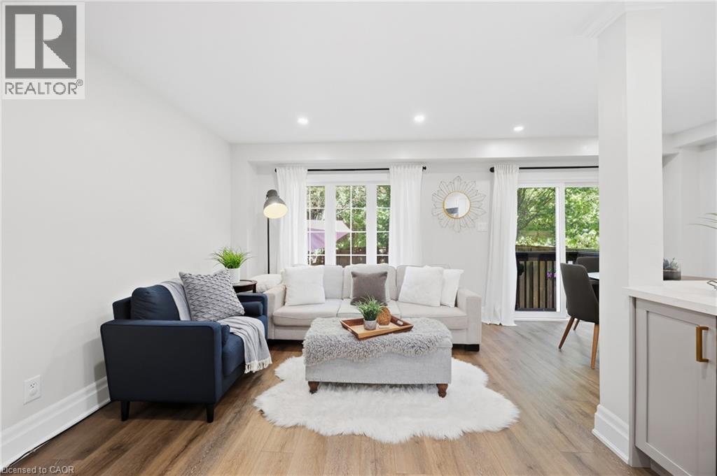Wood-finish flooring, recessed lighting, and white crown molding - 2409 Postmaster Drive, Oakville, ON
