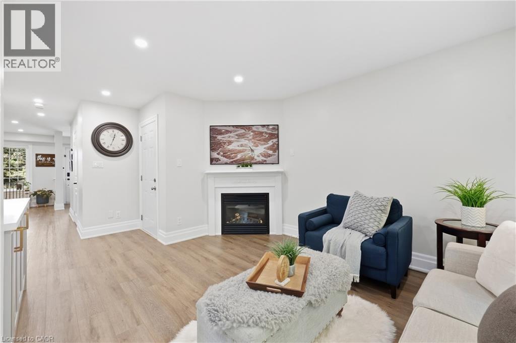 Recessed lighting illuminating wood-finish flooring - 2409 Postmaster Drive, Oakville, ON