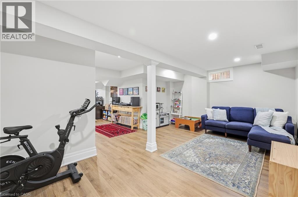 Recessed ceiling lighting, wood-finish flooring, and white painted walls - 2409 Postmaster Drive, Oakville, ON