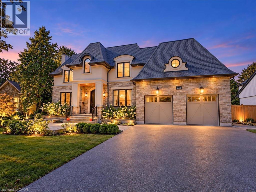 Stone veneer facade with a prominent portico entrance - 236 Poplar Drive, Burlington, ON