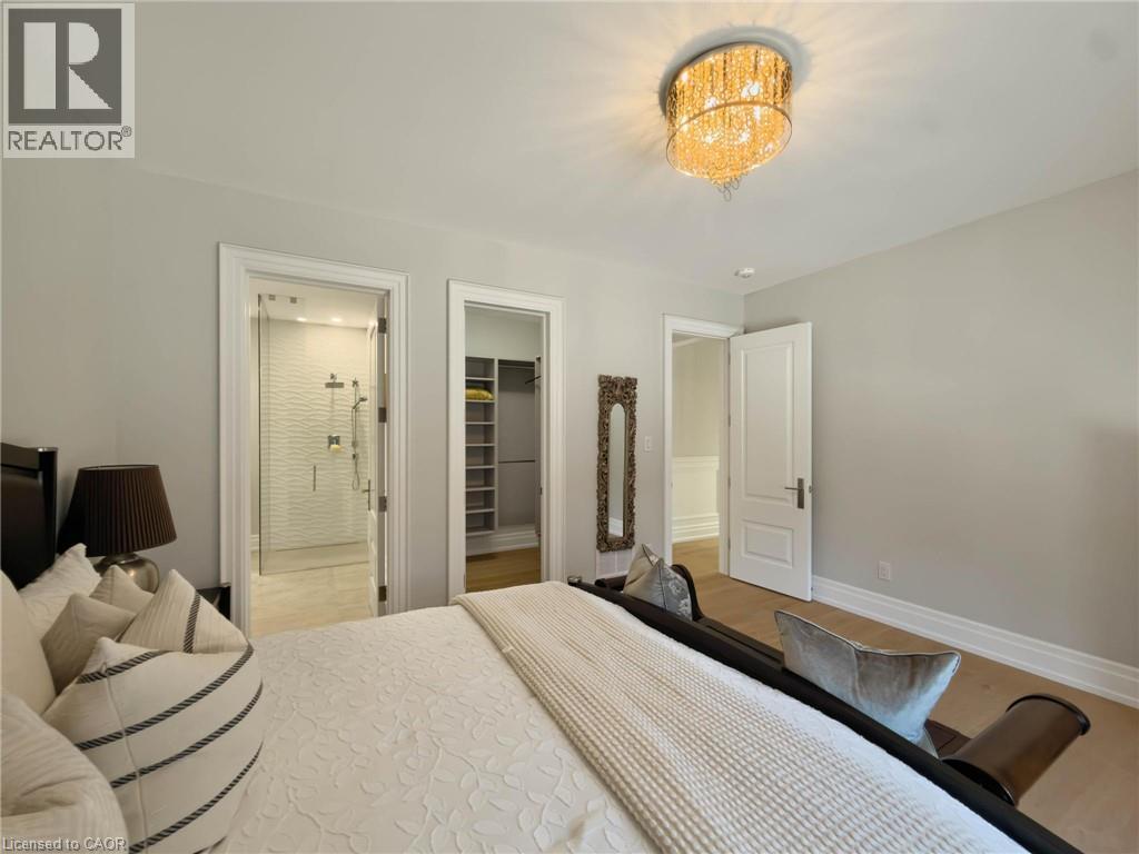 Recessed lighting and a decorative ceiling fixture illuminate the space - 236 Poplar Drive, Burlington, ON