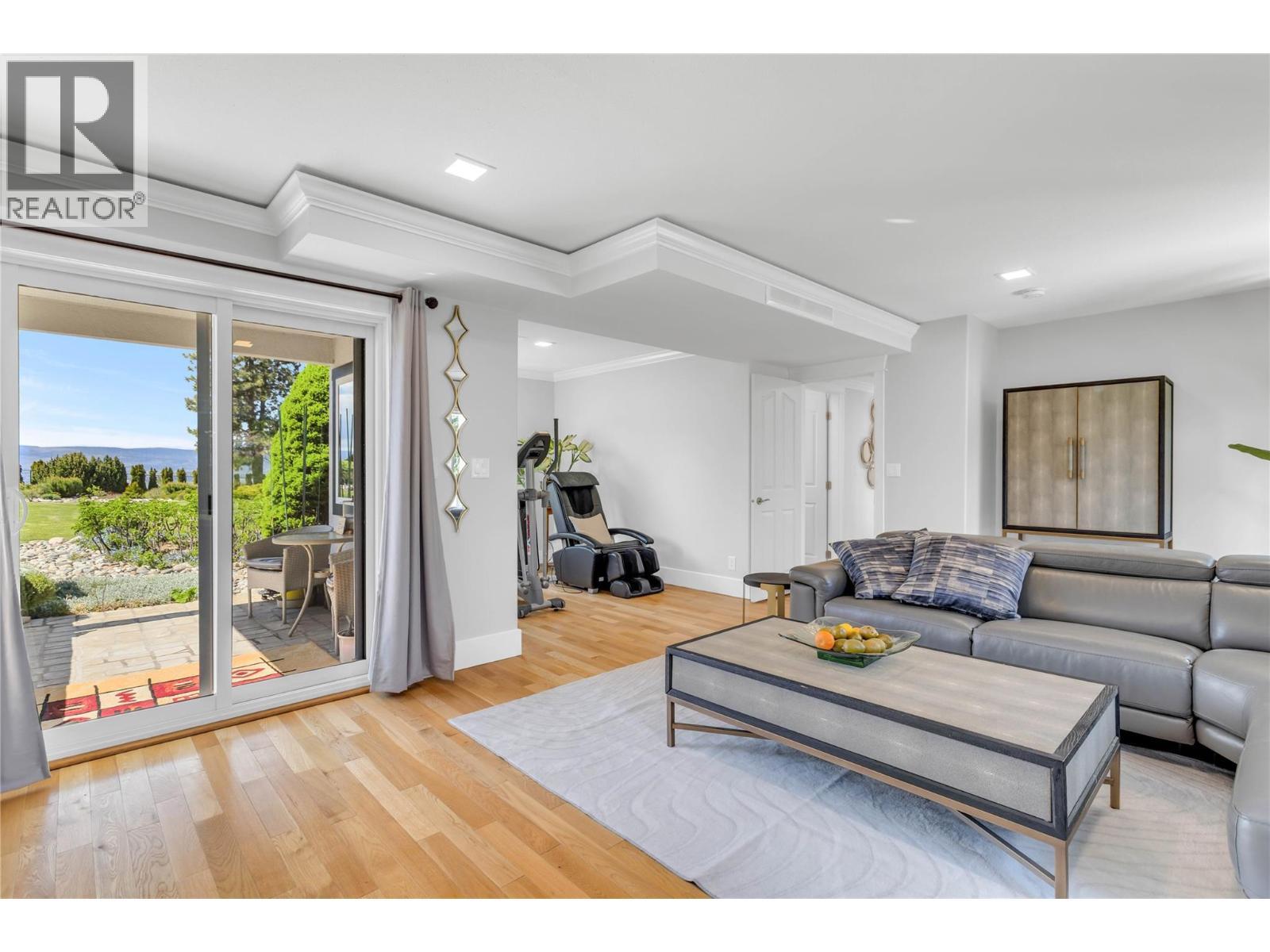 Family/exercise room with a covered patio - 4325 Takla Road, Kelowna, BC
