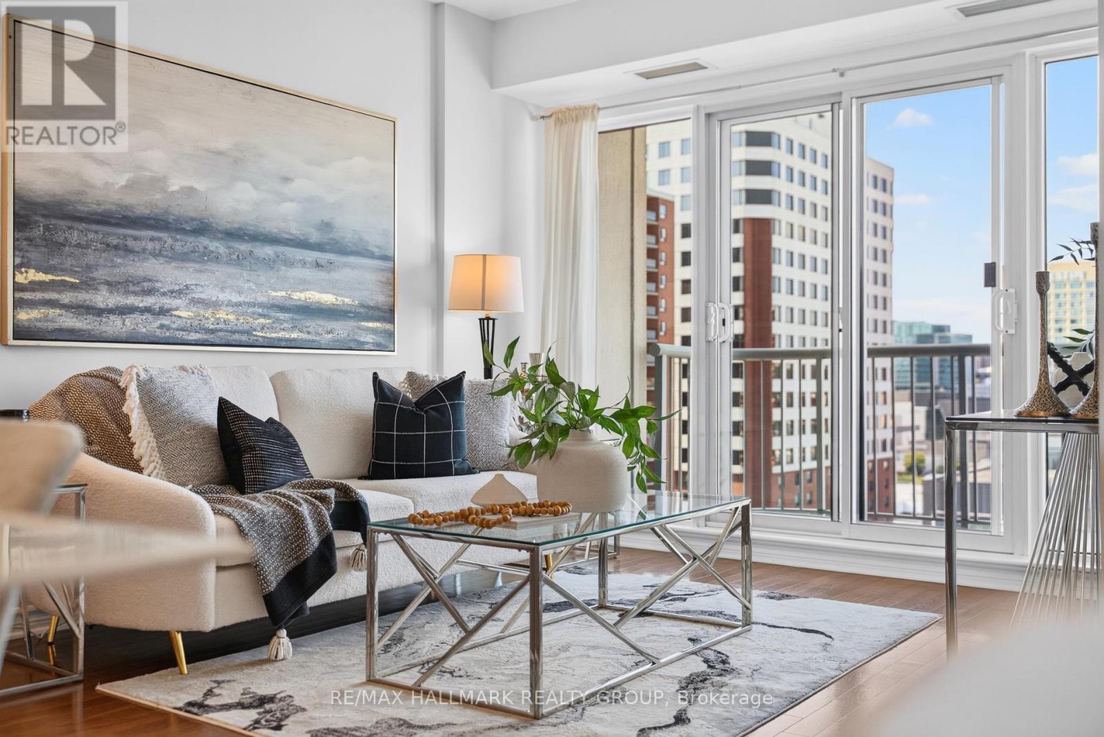 Living room with floor-to-ceiling windows - 1405 - 200 Rideau Street, Ottawa, ON