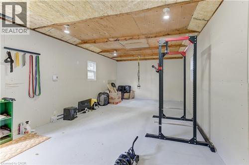 Expansive open space with light-colored flooring, multiple windows, and recessed ceiling lighting - 64 Stanley Street, Cambridge, ON 