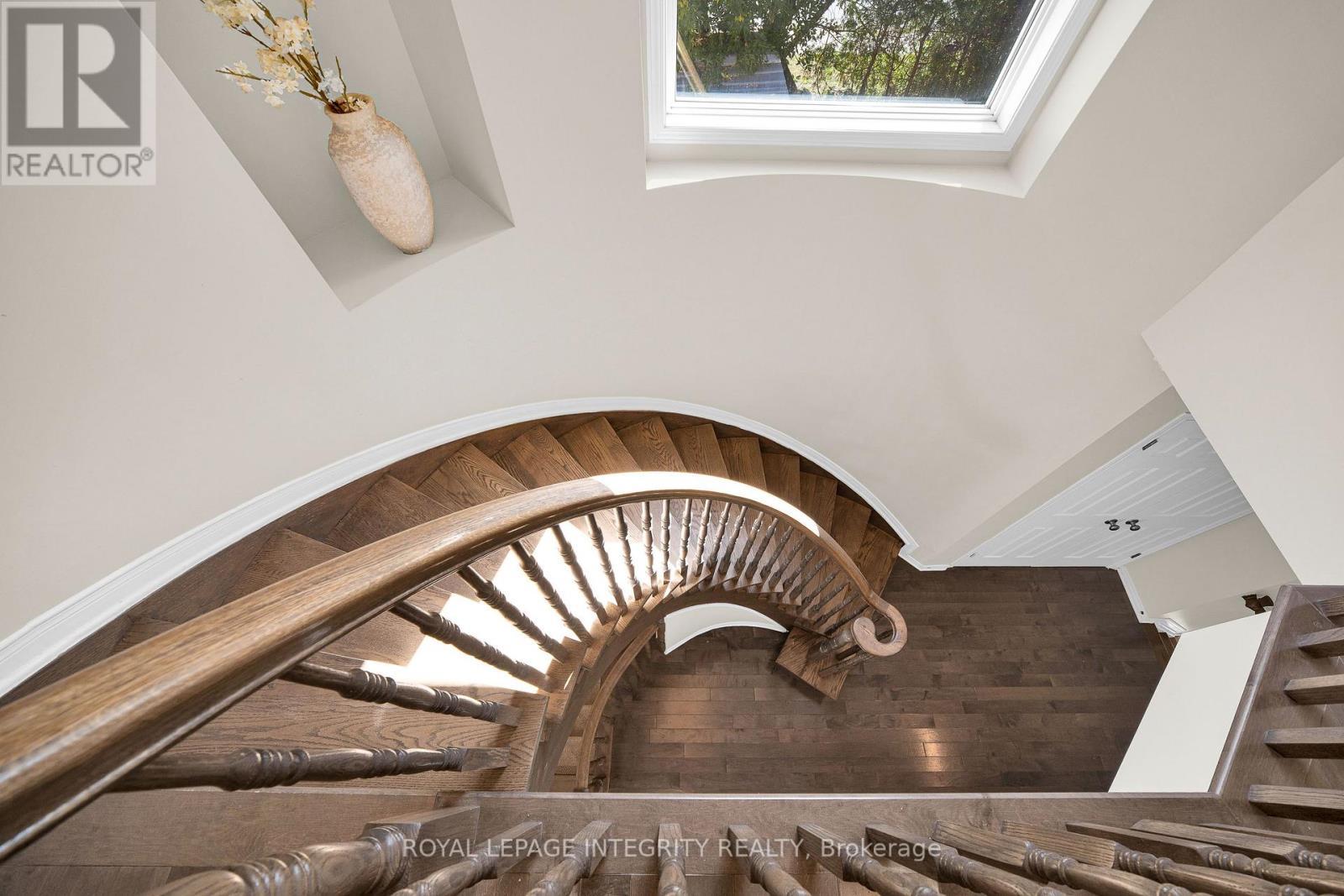 Beautiful curved wood staircase - 170 Flamborough Way, Ottawa, ON