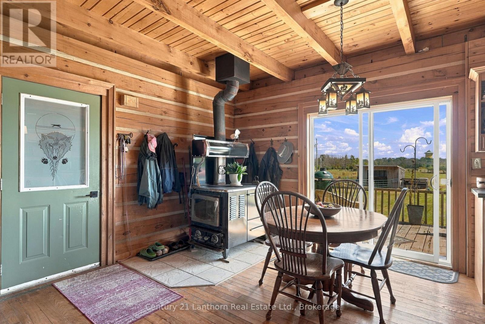 Eat-in kitchen with wood burning cookstove - 939 Kelly Road, Prince Edward County (Athol Ward), ON