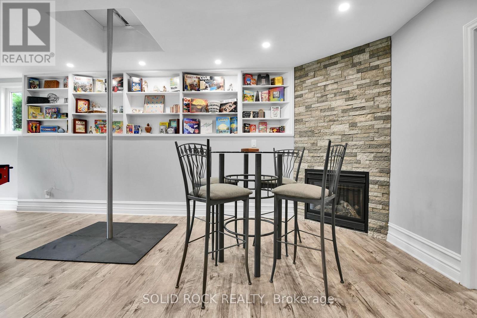 Games Area with Gas Fireplace - 7040 Donwel Drive, Ottawa, ON