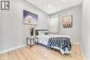 Recessed lighting, wood-finish flooring, light grey walls, and a window with curtain rod - 101 Emerald Street N, Hamilton, ON 