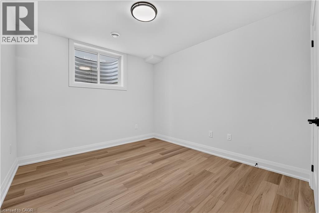 Recessed window featuring a corrugated metal well - 8905 Angie Drive, Niagara Falls, ON