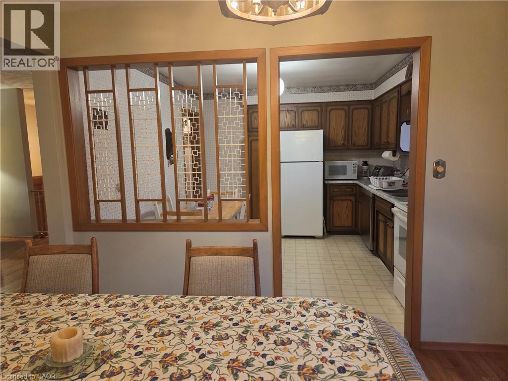 Wood-finish room divider with decorative screens - 410 Lakeview Drive, Waterloo, ON
