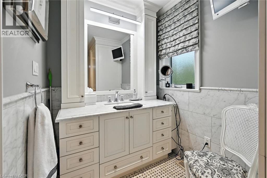 Built-in vanity with extensive storage and a single basin sink - 2209 Ghent Avenue, Burlington, ON