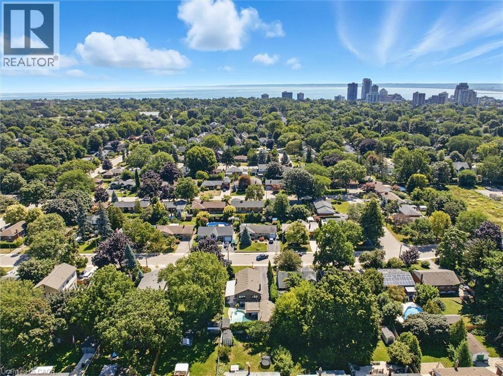 Aerial perspective showcasing residential properties within a tree-lined neighborhood - 2209 Ghent Avenue, Burlington, ON