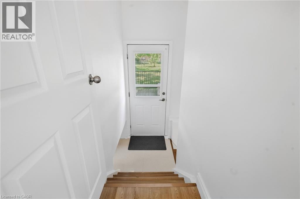 White paneled door with a round knob - 49 Beverly Crescent, Welland, ON