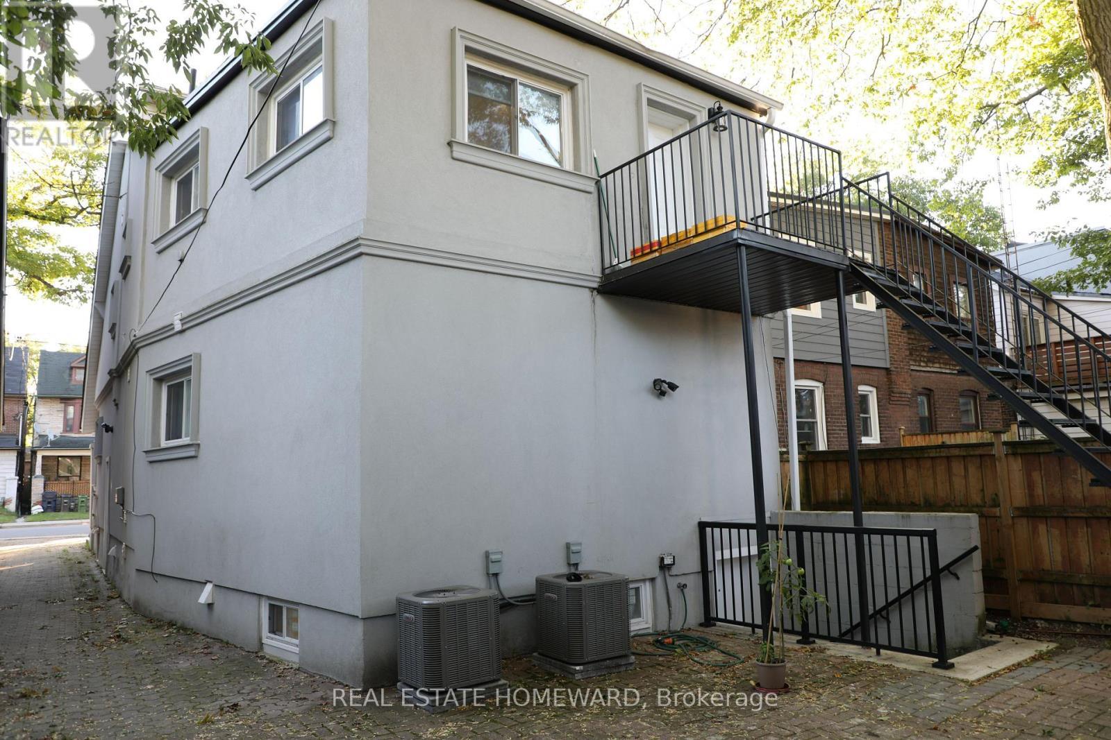 Rear entrance to lower level unit & fire escape. - 434 Victoria Park Avenue, Toronto, ON