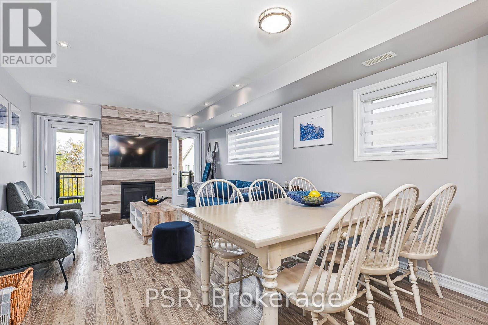Dining/Living & Doors to Balcony - 308 - 4 Anchorage Crescent, Collingwood, ON