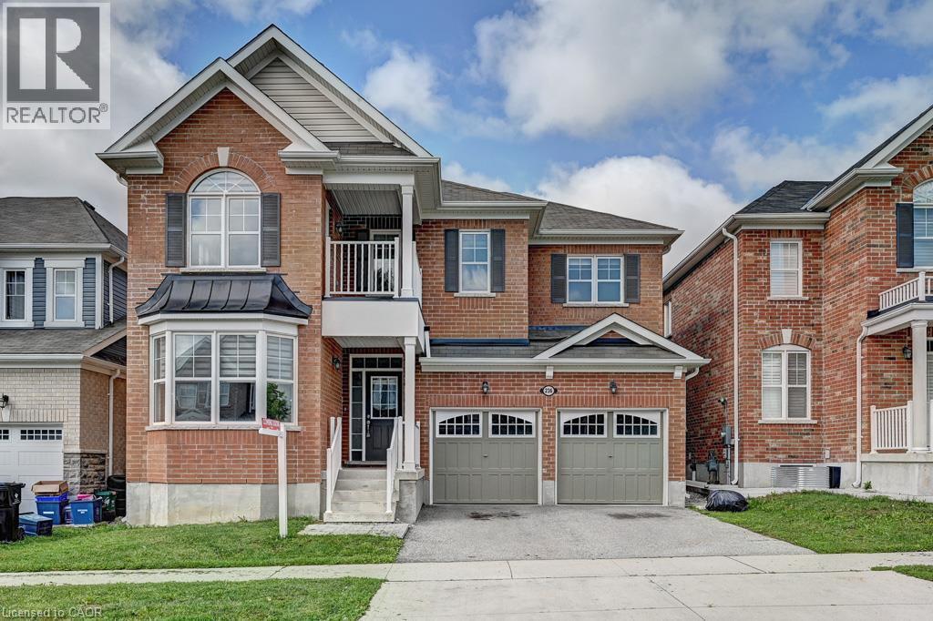 Brick exterior with a gabled roof and bay window - 236 Ridge Road, Cambridge, ON