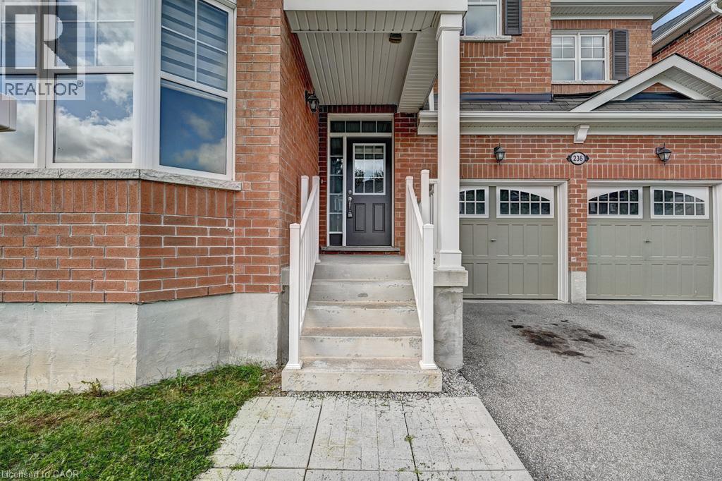 Brick exterior with a prominent bay window - 236 Ridge Road, Cambridge, ON