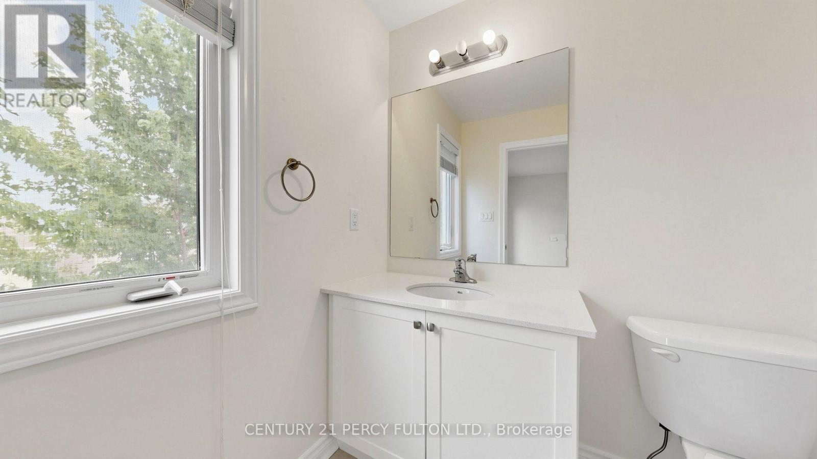 Ensuite Bathroom with Vanity and Window - 64 Ferris Square, Clarington, ON