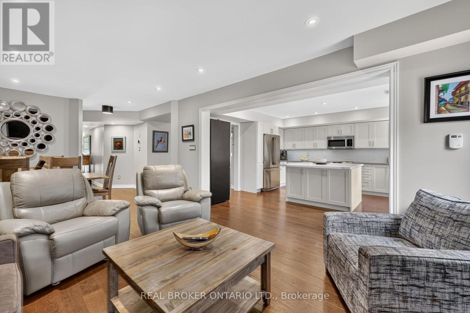 Family room open to kitchen and dining - 30 Masters Crescent, Georgian Bay, ON