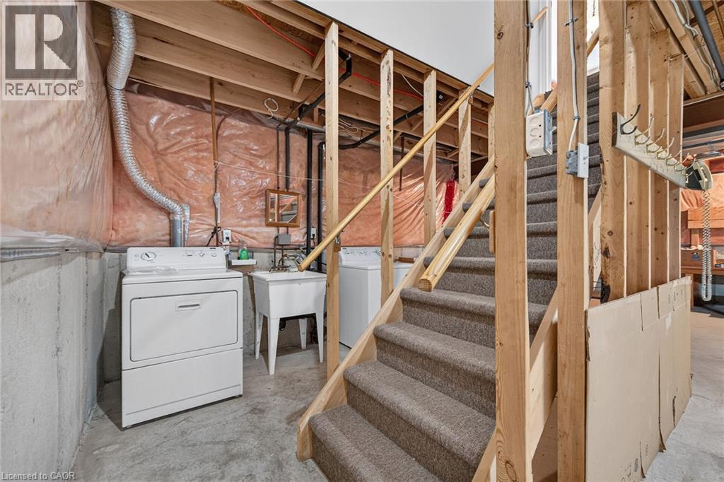 Carpeted staircase with wooden railings and framing - 795 Tenth Avenue, Hamilton, ON