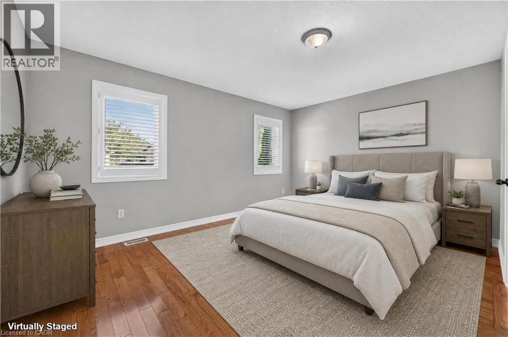 AI generated staging. Hardwood flooring, light gray wall paint, and white trim - 795 Tenth Avenue, Hamilton, ON