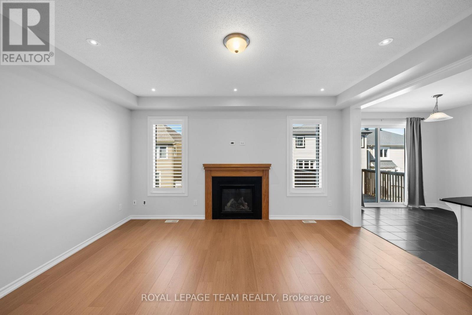Gas Fireplace in Living Room - 32 Escallonia Court, Ottawa, ON
